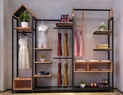Il negozio di vestiti indipendente degli scaffali di esposizione dell'abbigliamento visualizza il materiale del metallo/MDF
